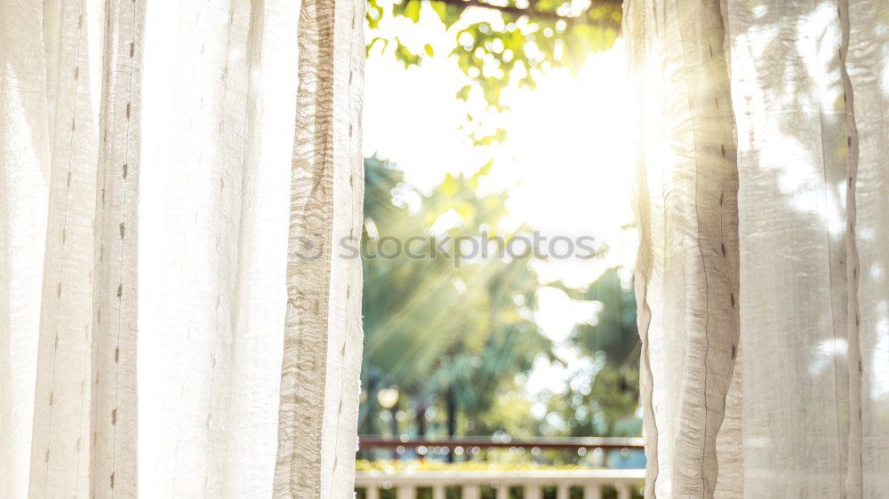 Similar – Opened window with curtains and flowered curtains