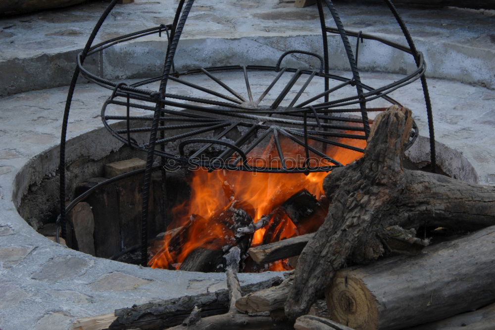 Similar – Image, Stock Photo Goulash beeing cooked in a cauldron over an open fire on a picnic.