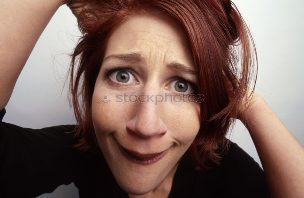 Similar – Beautiful, redhead and young woman making a funny face