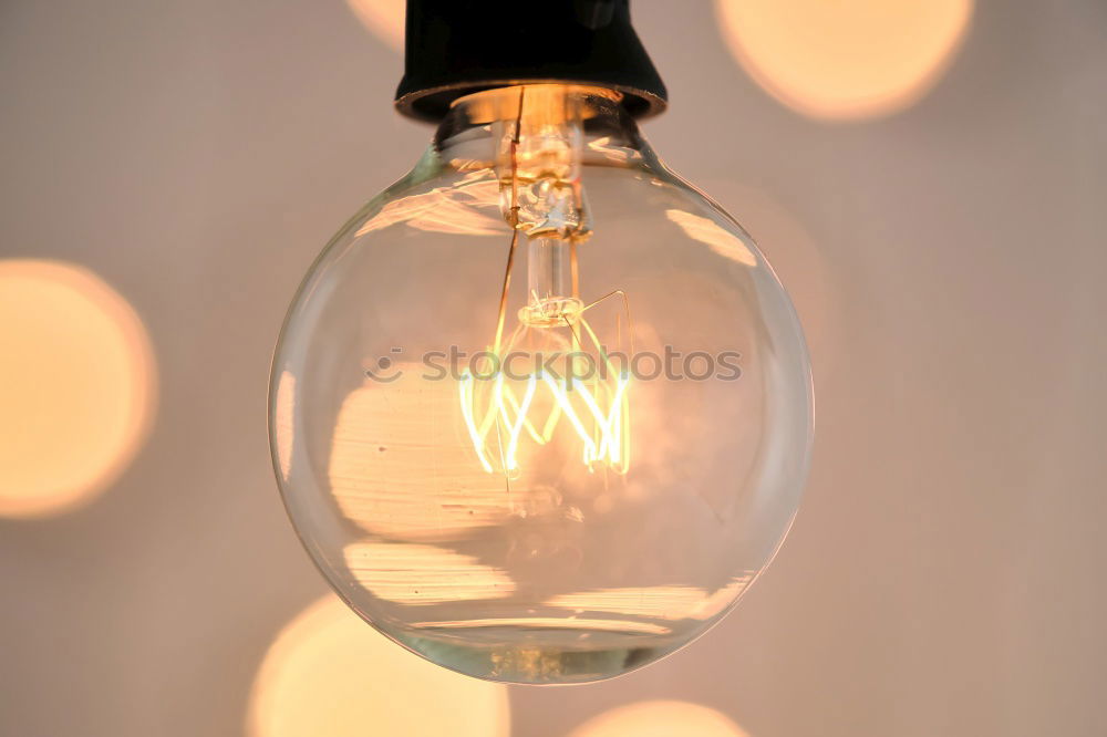 Similar – Orange-coloured LED lights in a row in incandescent optics, shallow depth of field