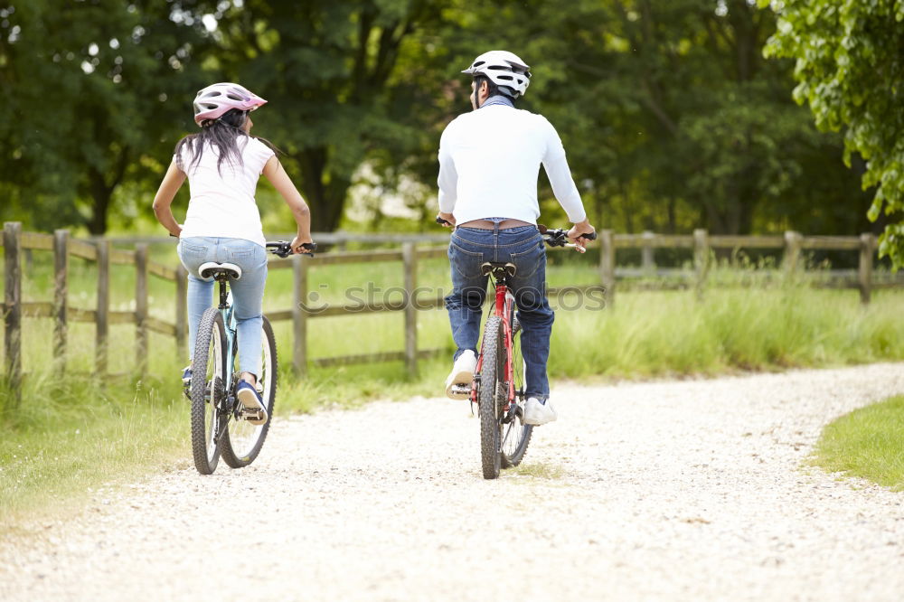 Similar – Image, Stock Photo Women on bikes giving high five