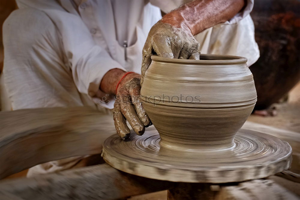 Similar – Image, Stock Photo Close-up of clay vase on wheel