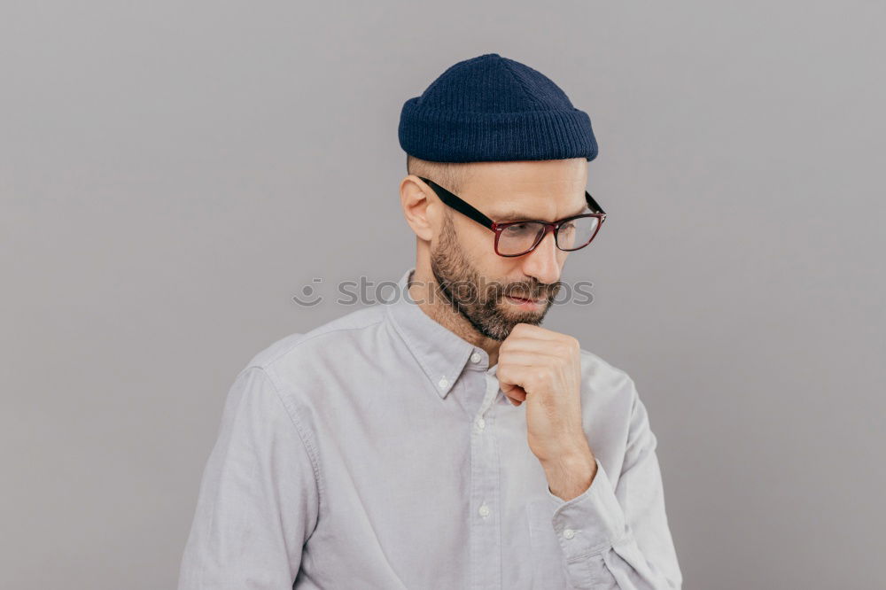 Similar – Man with cup and phone at window