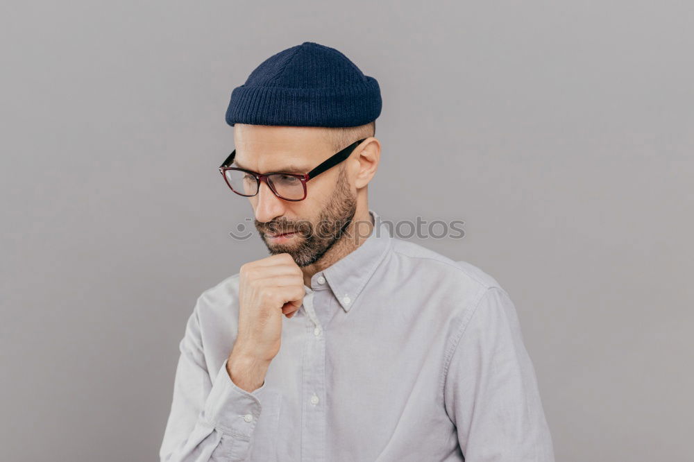 Similar – Man with cup and phone at window