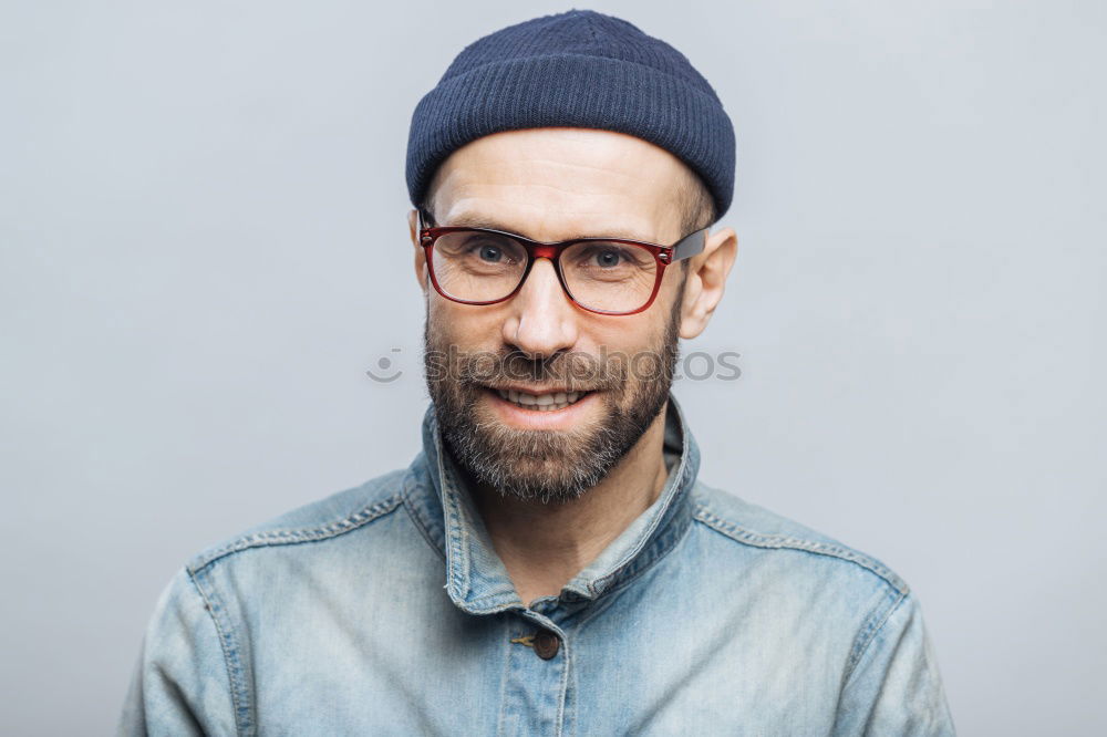 Similar – Man with mustache and glasses standing looking at camera.