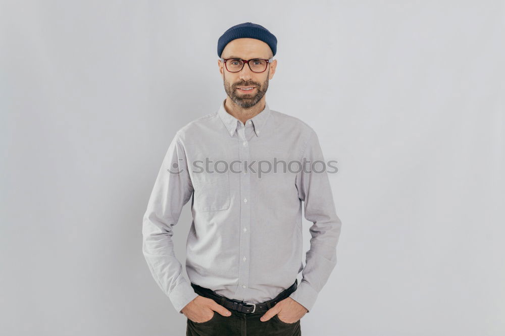 Similar – Man with mustache and glasses standing with crossed arms.