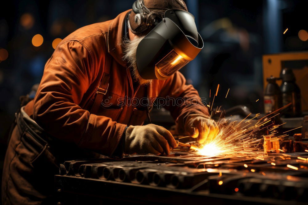 Similar – worker using an angle grinder