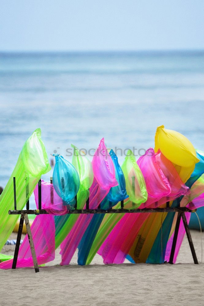 Similar – colorful Pedalos on the beach sand