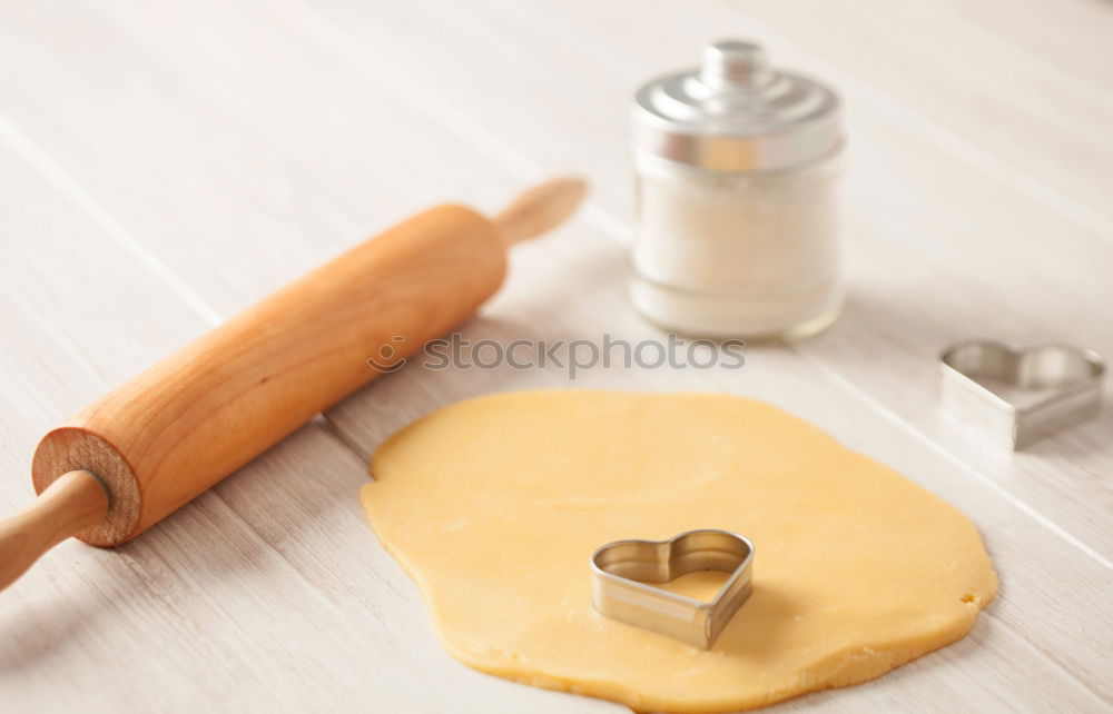 Similar – Image, Stock Photo Close up of cookie cutters and rolling pin on a dark table