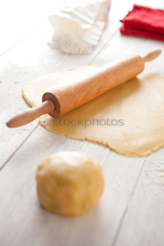 Similar – Image, Stock Photo Making homemade taglatelle with a pasta rolling cutter