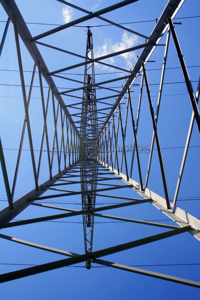 Similar – Power pole from the inside from the frog’s perspective in front of a blue sky