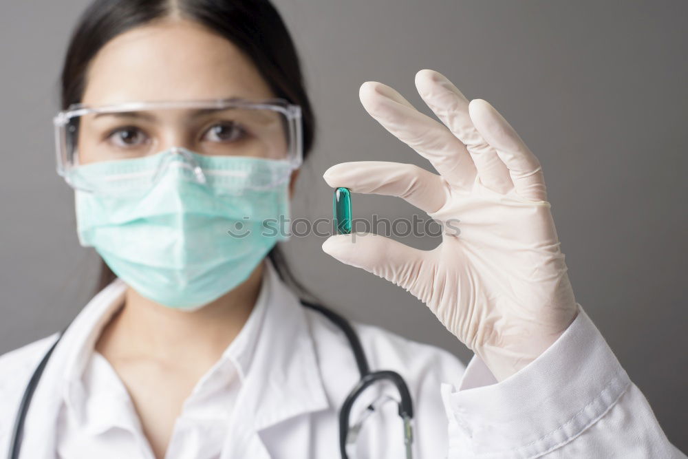 Similar – Image, Stock Photo Female doctor with face mask, protective gloves and lab coat