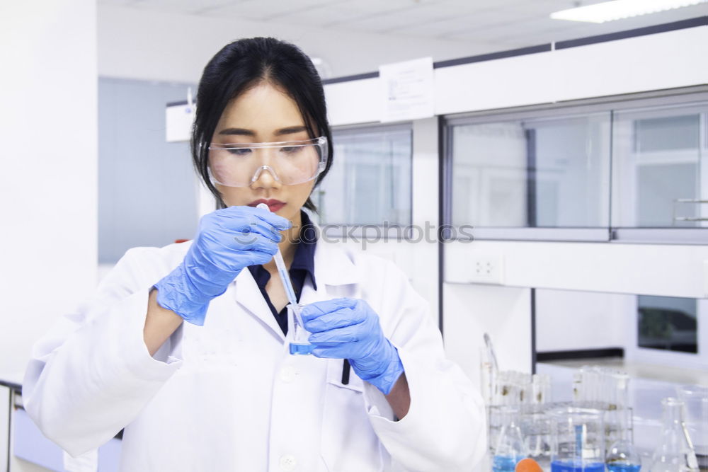 Similar – Image, Stock Photo Woman looking at test tube