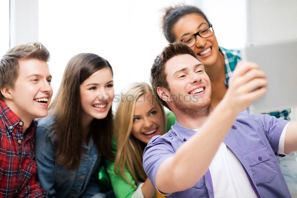 Similar – Group of friends taking selfie in urban park