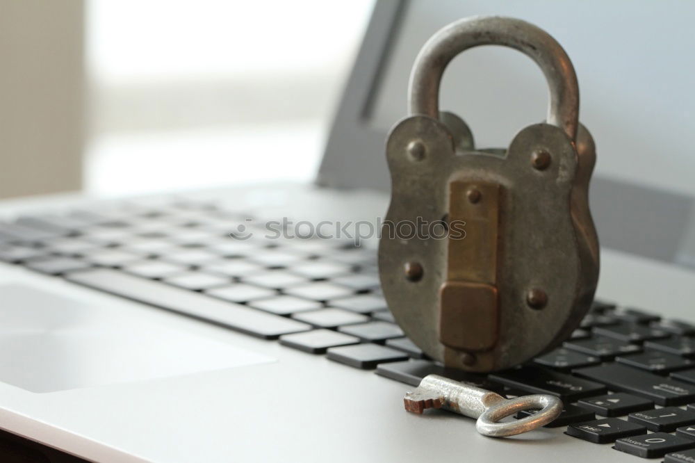 Similar – Lock in front of notebook as symbol for data protection & DSGVO