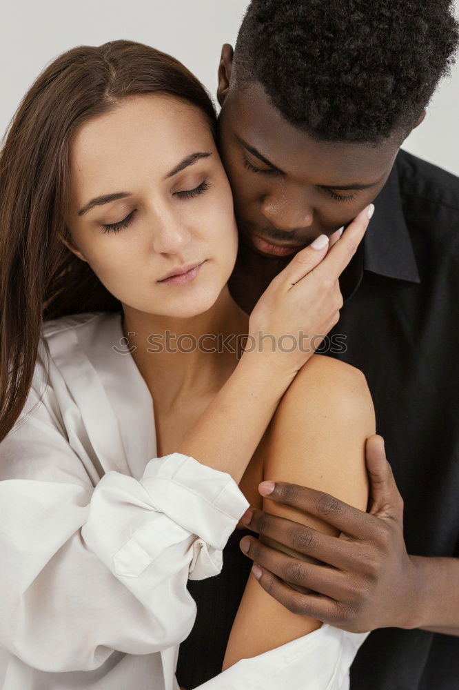 Similar – Loving Young Couple Hugging And Kissing At Home Standing In Kitchen Together