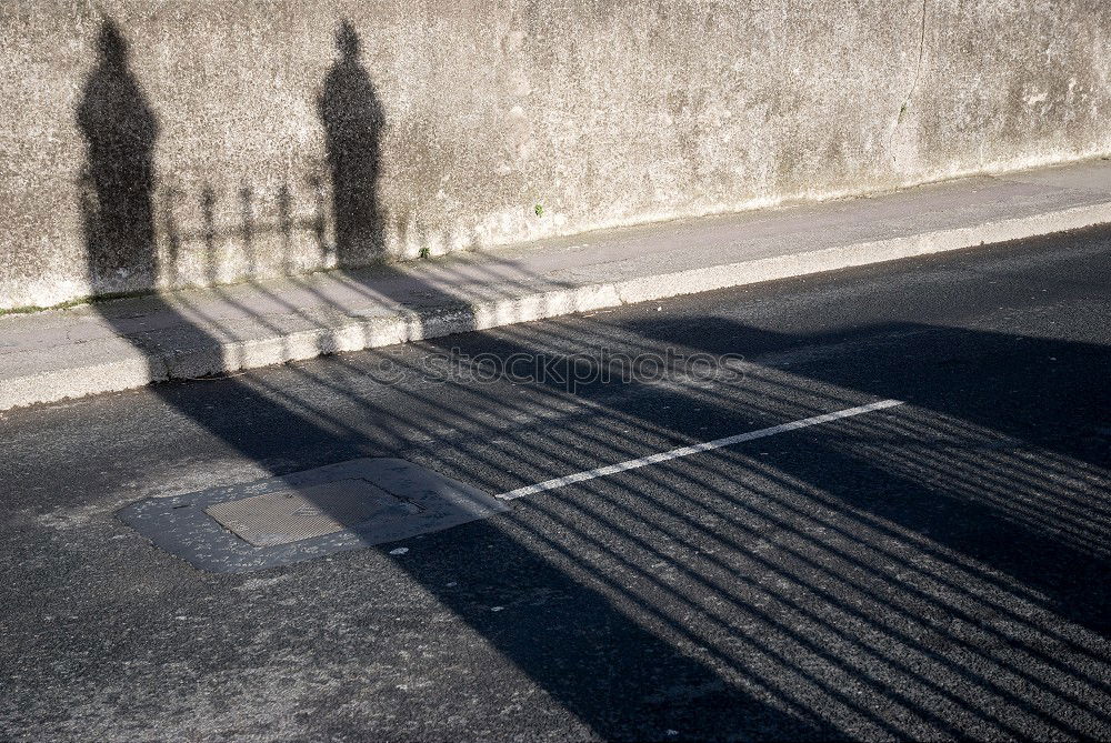 Similar – Schatten von Frau mit Tasche auf Stein