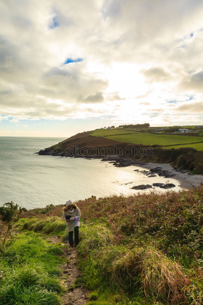 Image, Stock Photo Woman standing on the coast by the sea in England