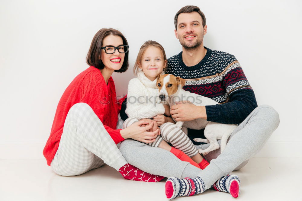 Similar – Mature couple relaxed at home in bed with their four little daughters and the Dog