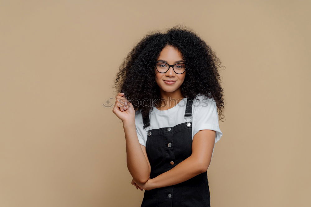 Similar – Young black woman, afro hairstyle, smiling outdoors