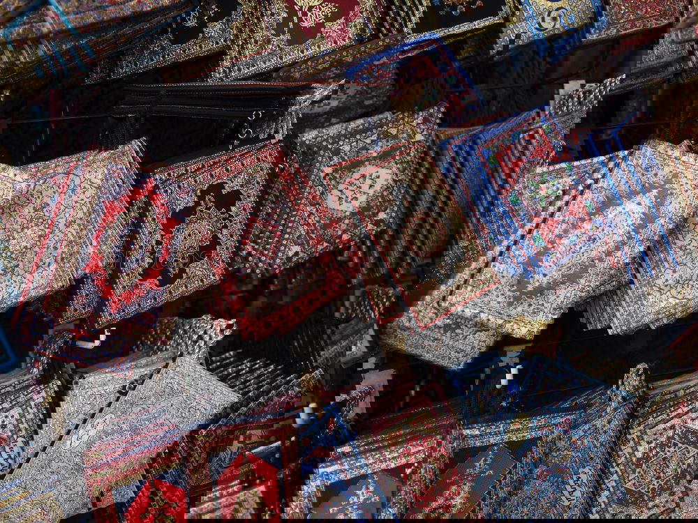 Similar – Image, Stock Photo Seller showing carpet in market