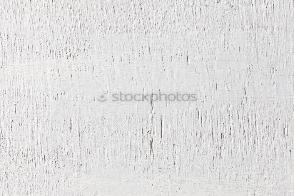 Similar – Painting a rough wall in a white color by paint roller