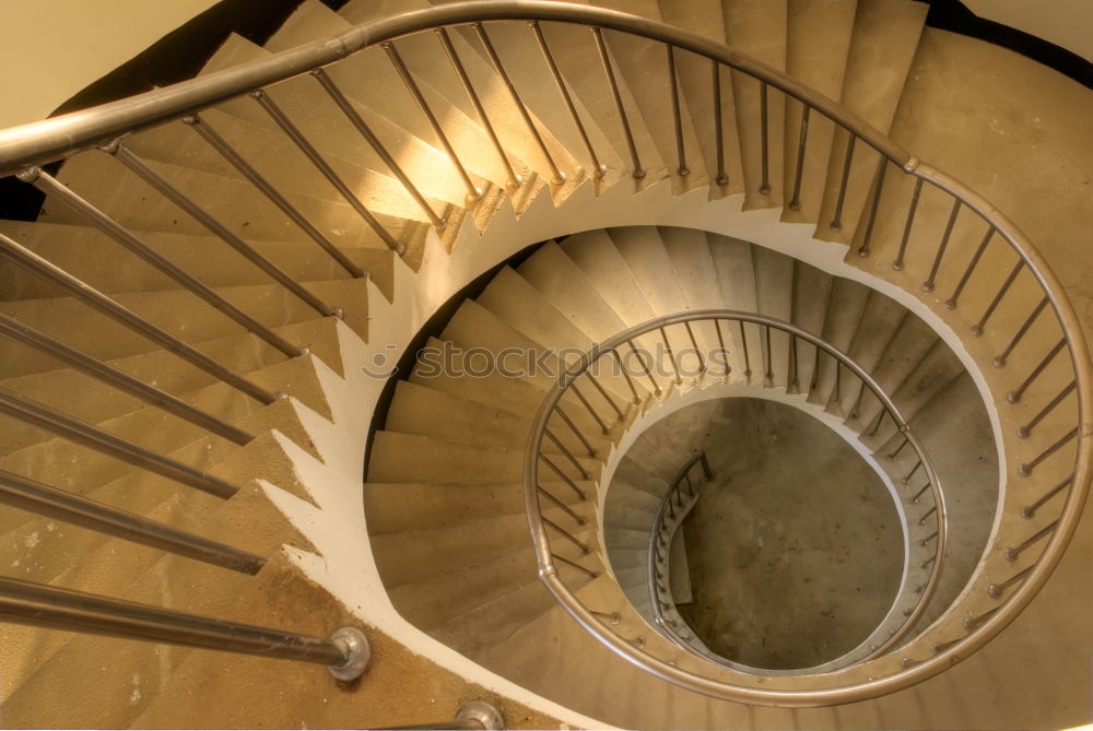 Similar – Top view of a spiral staircase in an old building