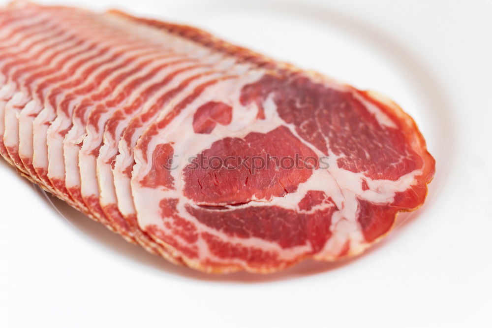 Similar – Image, Stock Photo Cutter carving slices from a whole bone-in serrano ham