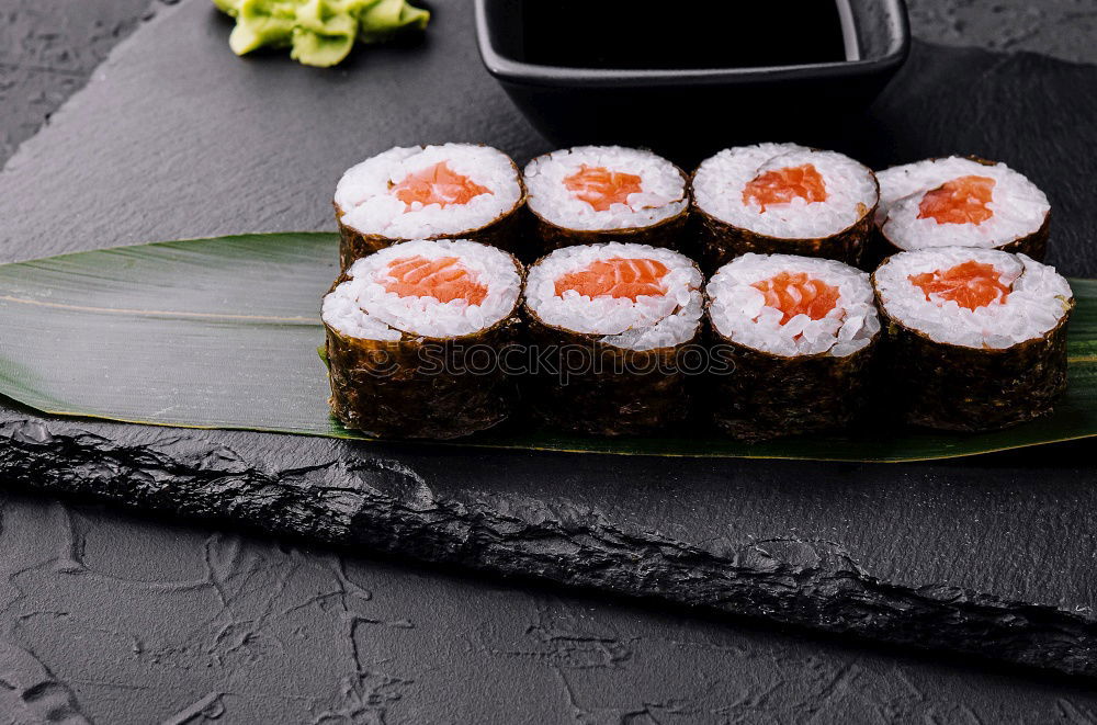 Similar – Chopstick with a sushi on black stone