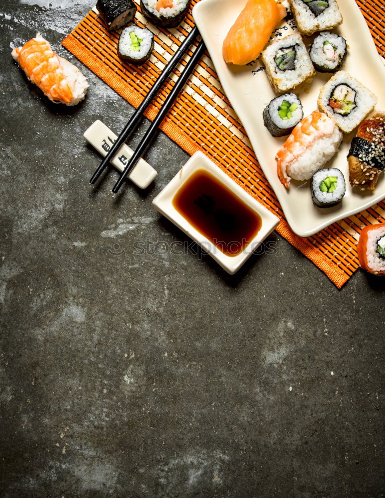 Similar – Chopstick with a sushi on black stone