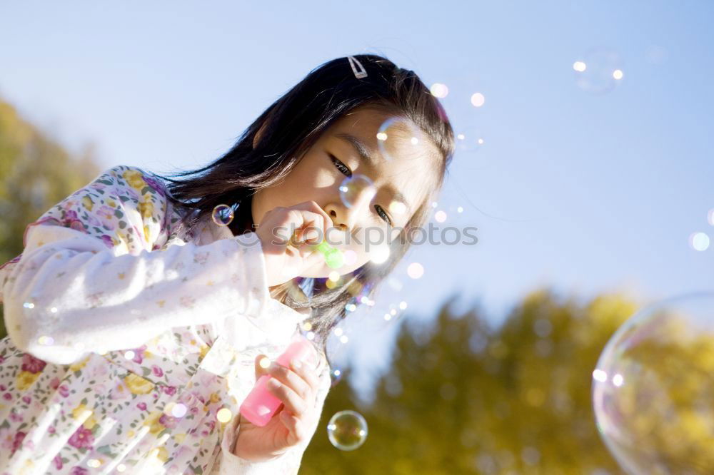 Similar – Image, Stock Photo Teenage girl making fun with bubbles