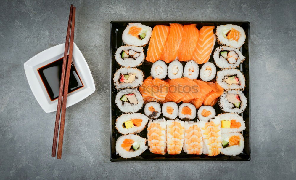 Similar – Japanese food: maki and nigiri sushi set on black background.