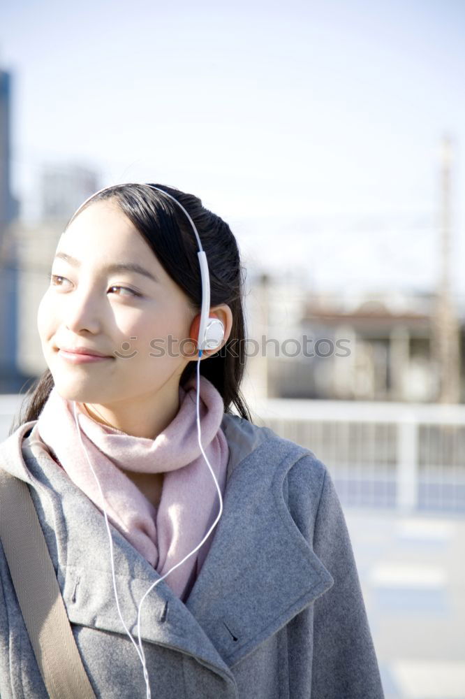 Similar – Woman standing on the street