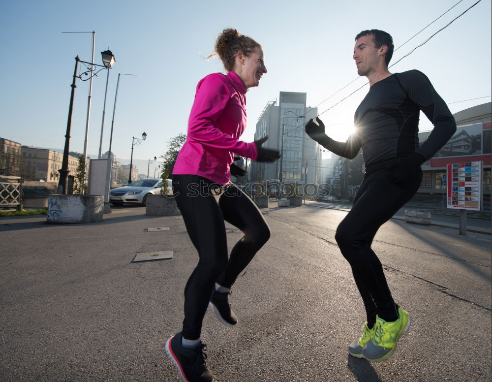 Similar – Active young couple jogging in an urban street