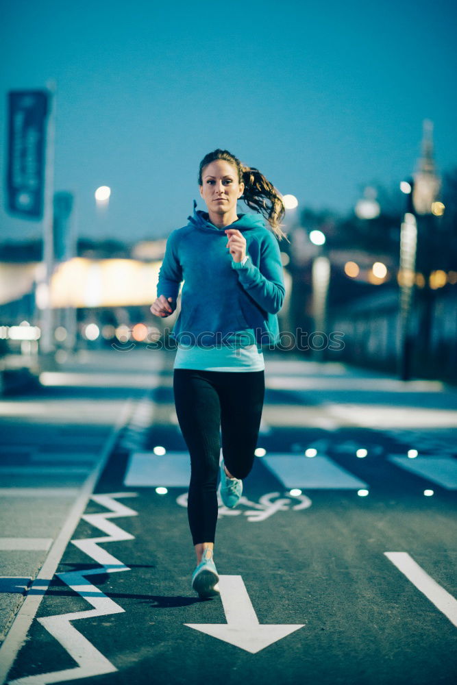 Similar – Image, Stock Photo Young couple running on a seafront promenade