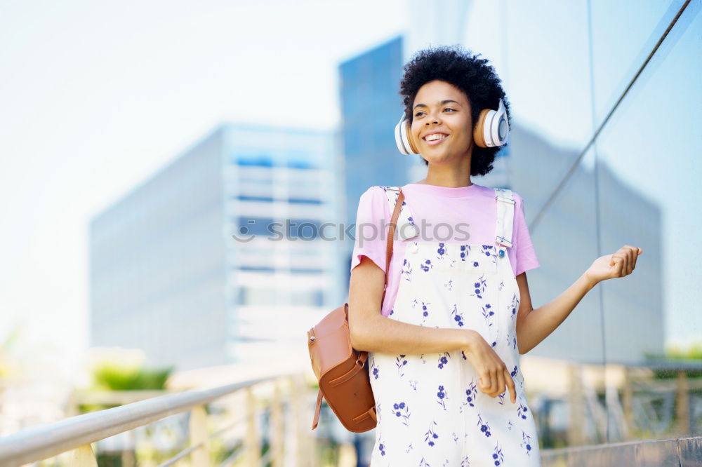 Similar – Image, Stock Photo African woman listening to music with earphones and smartphone