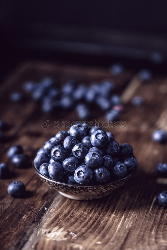 Similar – Image, Stock Photo Freshly gathered blueberries put into ceramic bowl