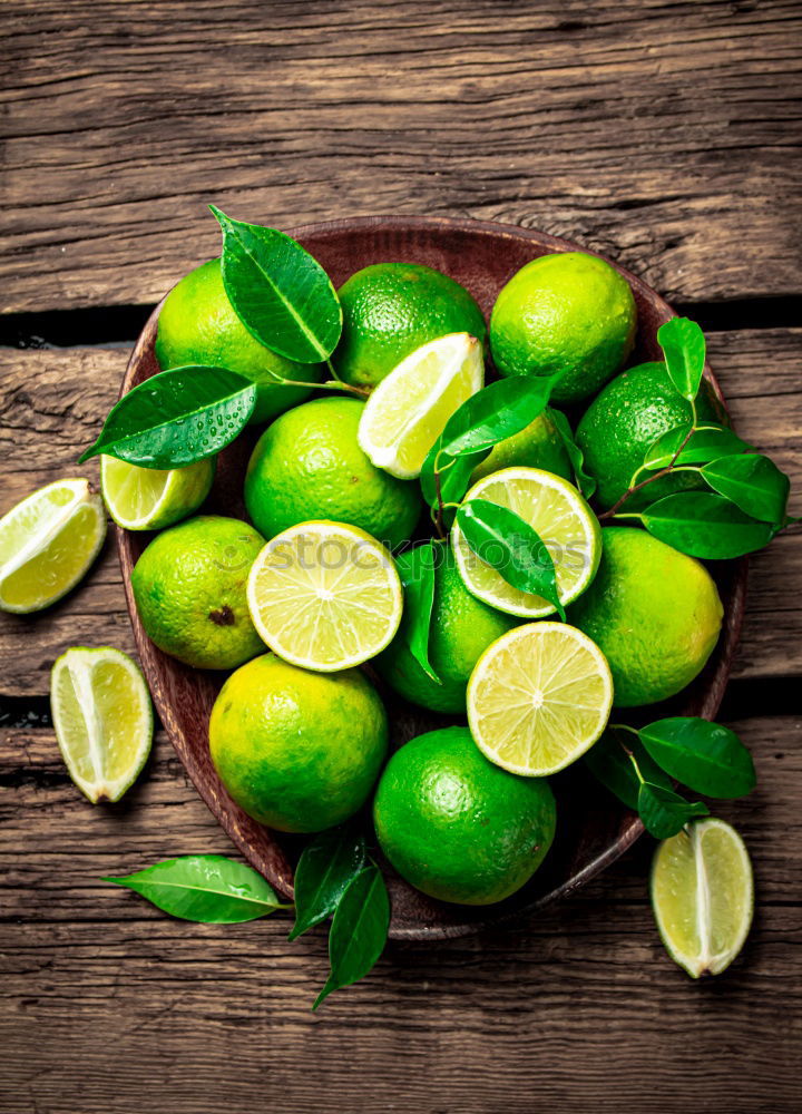 Similar – Image, Stock Photo Lime juice in bottle with fruits and juicer