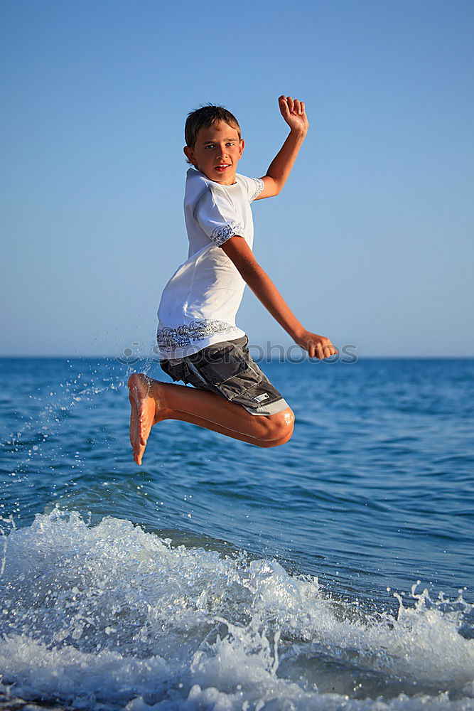 Similar – Image, Stock Photo One happy little boy playing on the beach at the day time.