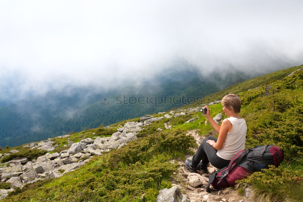 Similar – Woman walks on a mountain path in a sunny day.