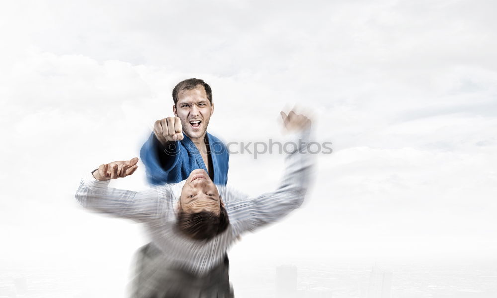 Similar – Two businessmen shaking hands in the air