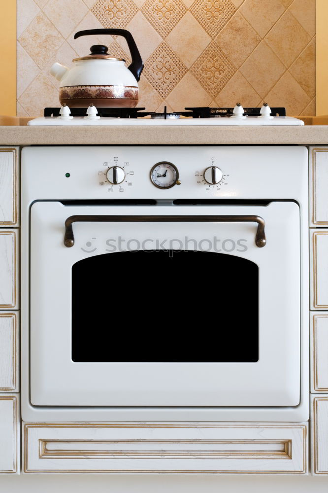 Foto Bild Freistehender Elektroherd Weiß mit Gusskochplatten und Espressokocher
