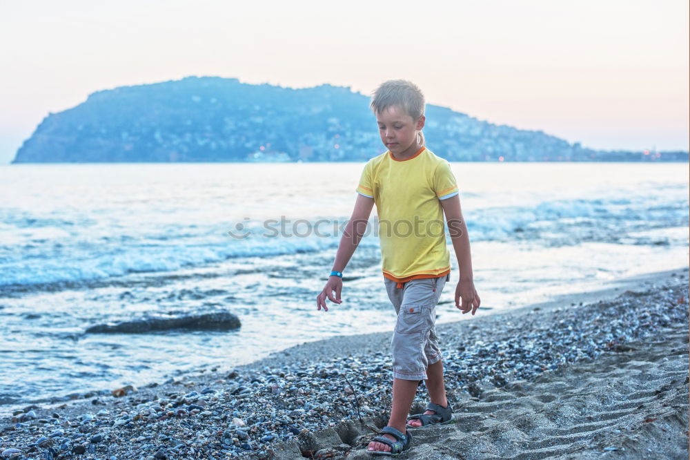 Similar – Image, Stock Photo Diver in wet suit standing on beach