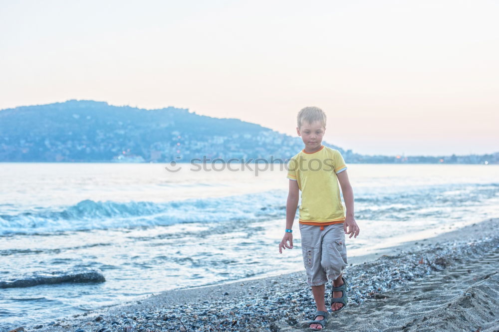 Similar – Image, Stock Photo Little boy on a dock sitting on his back looking to the ocean