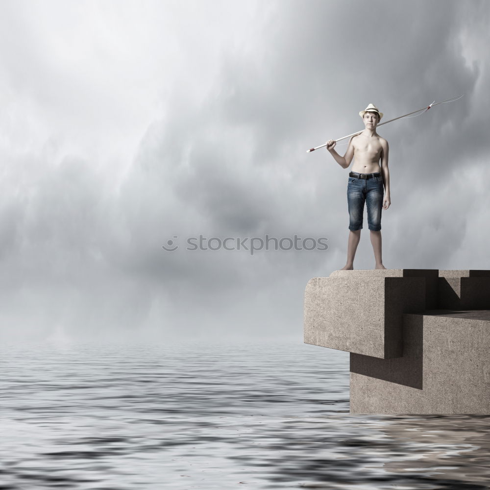 Similar – Person with surfboard standing near sea