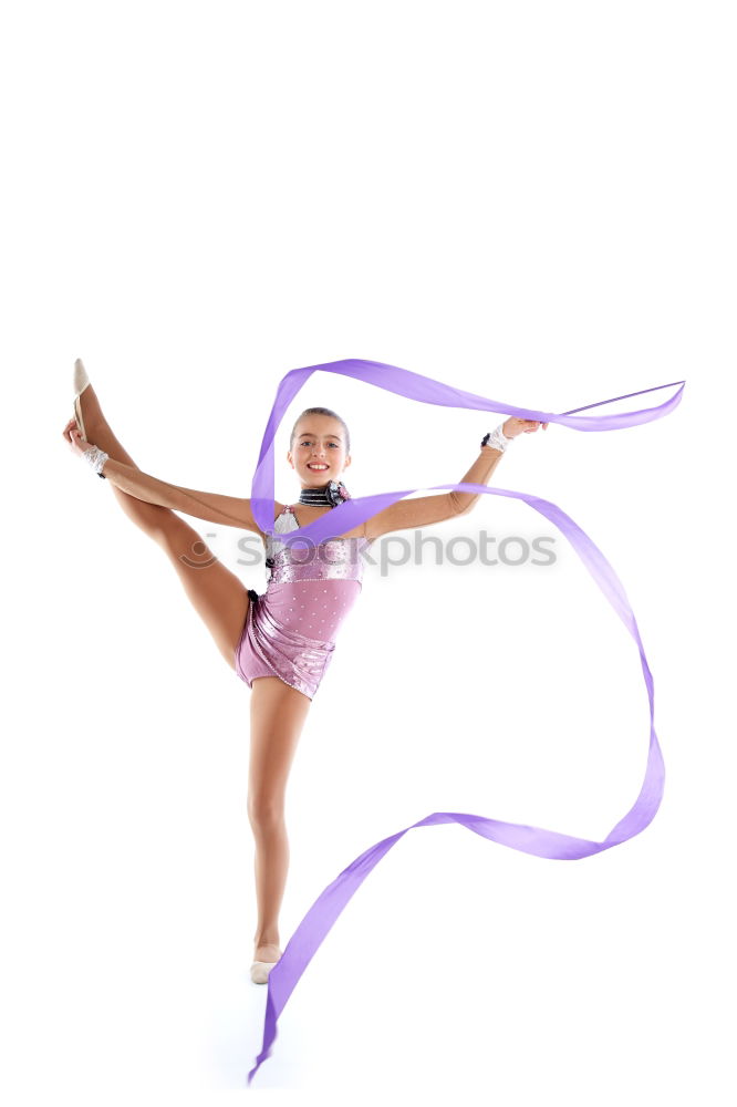 Similar – Teen rhythmic gymnast is holding leg in vertical split doing ribbon exercises.