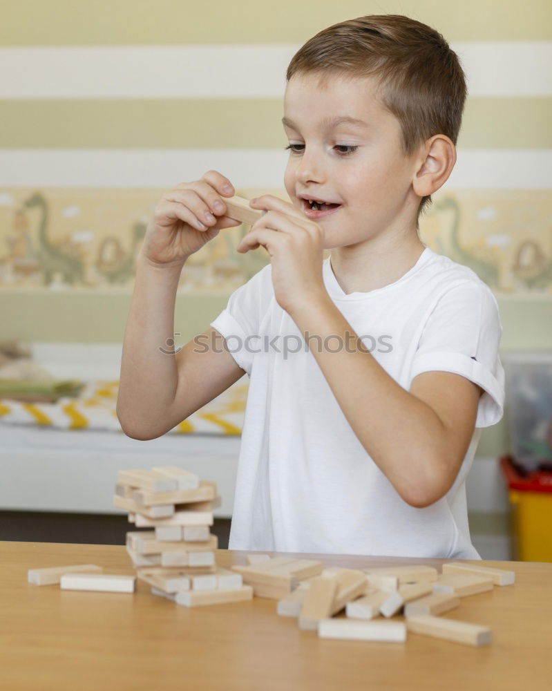 Similar – Girl decorating Christmas gingerbread cookies with chocolate