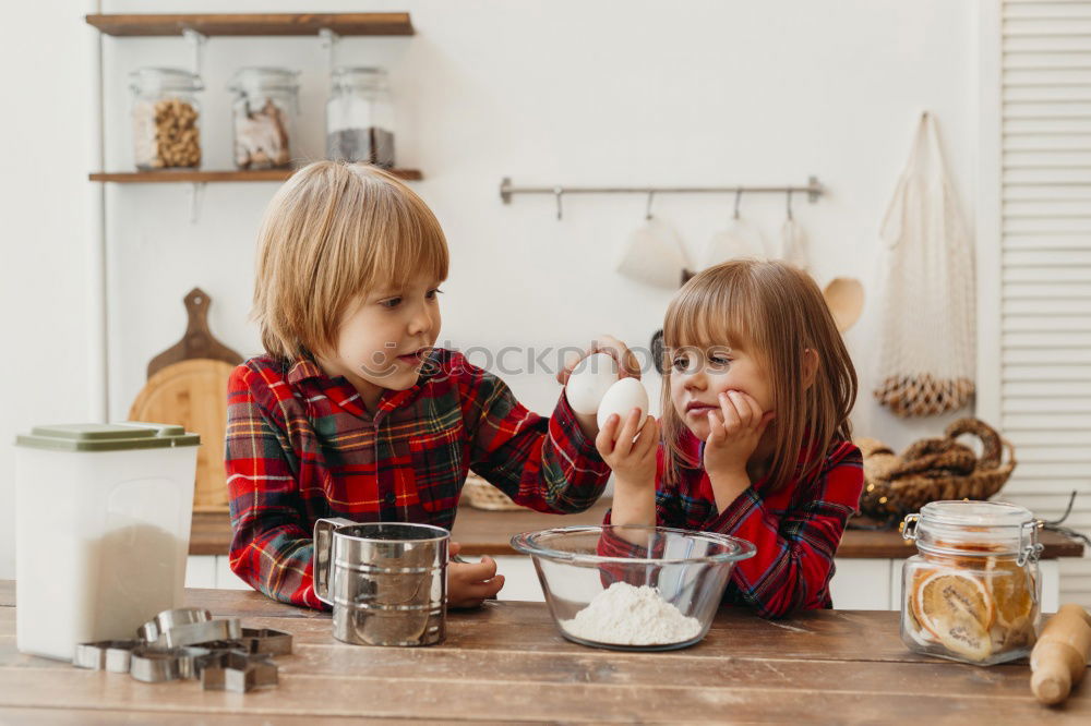 Similar – Little sisters girl preparing baking cookies.