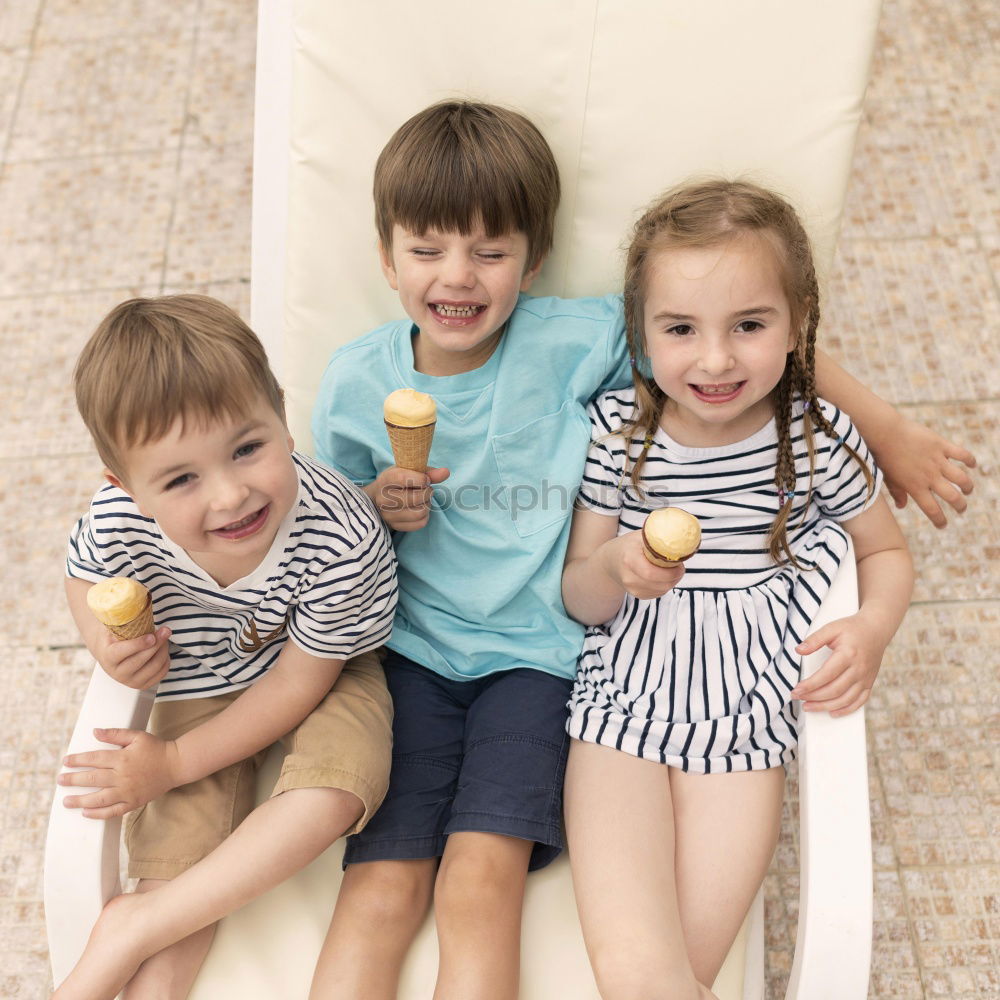 Similar – Image, Stock Photo Two happy children lie on a hammock and play with soap bubbles.