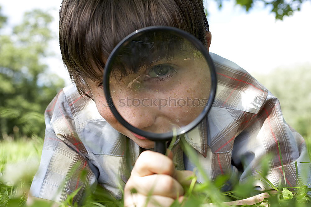 Similar – Foto Bild ein Mann blickt mit einem Fernglas durch einen Zaun